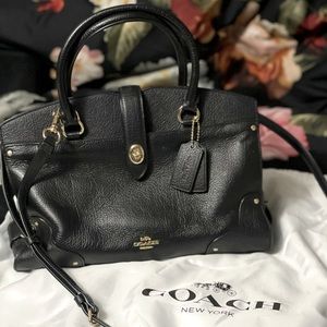 Genuine leather, authentic Coach bag.